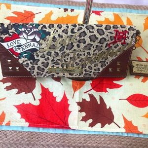 From Don and Ed Hardy Designs, a beautiful clutch in EUC!